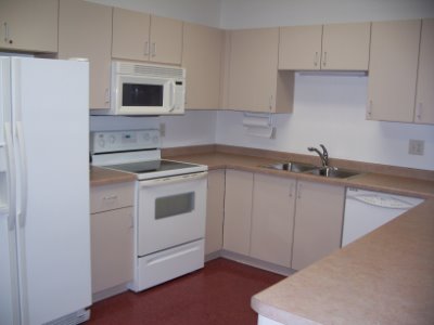 Picture of a kitchen with white appliances.